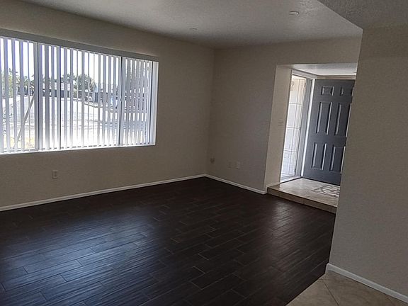 View from dining room to family room/ entry way front door