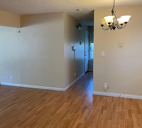 From the kitchen looking towards the garage entrance, side entry and basement steps.