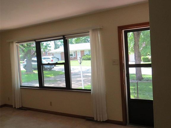 Living room flows into the dining room.