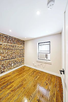 3rd image of 215 E 3rd St