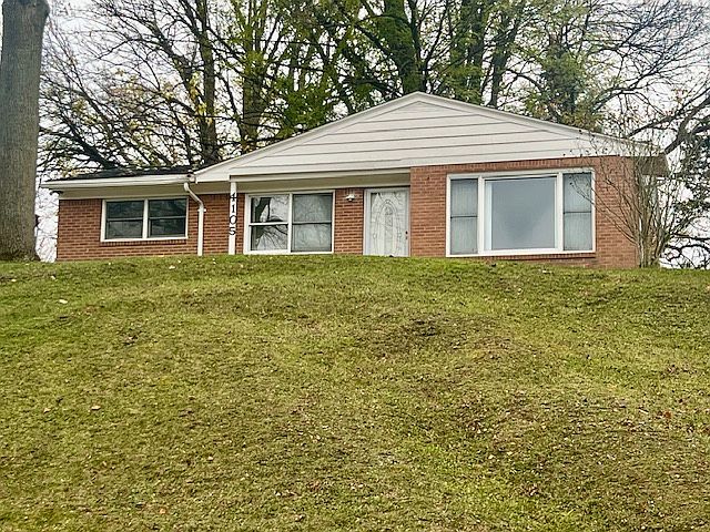 Front of homes. Sit on a hill where you can see pond in front of it!