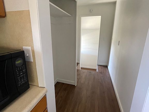 off kitchen leading to side door entry and stairs