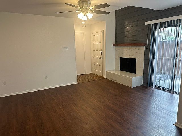 Another view of living room, with walk out to patio area