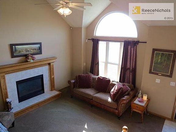 Living Room with Vaulted Ceilings & Gas Fireplace with Electric Circulator