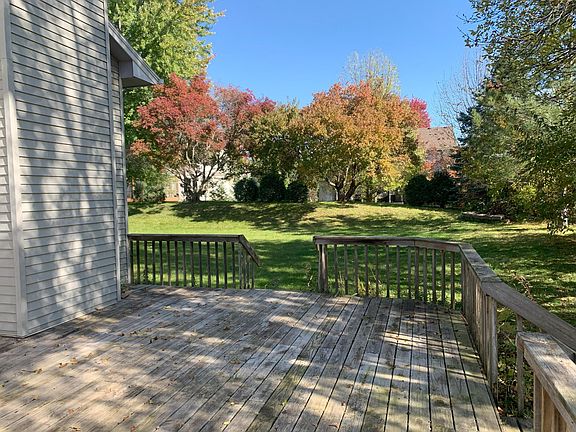 Large deck with views of backyard. Patio door from dining room leads directly the deck.