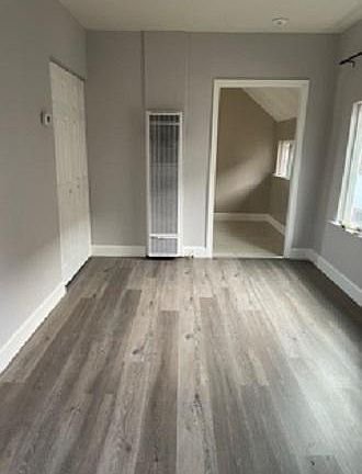 living area looking into kitchen entrance - closet on left