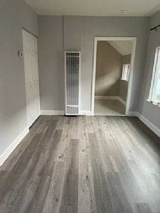 living area looking into kitchen entrance - closet on left