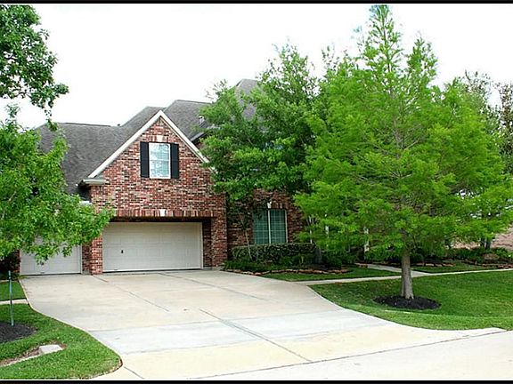 A view of the large three car garage with an extra extension for storage!