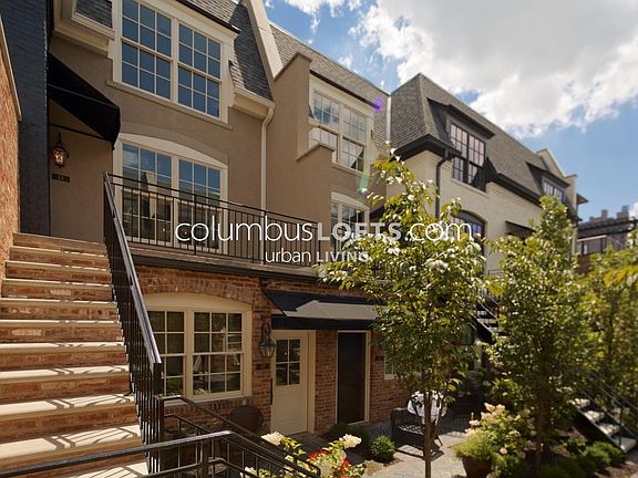 Exterior courtyard and dedicated stone steps up to condo unit private patio / front porch that overlooks courtyard