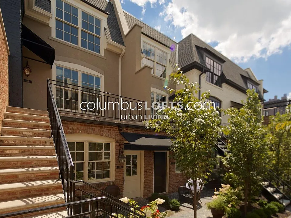 Exterior courtyard and dedicated stone steps up to condo unit private patio / front porch that overlooks courtyard