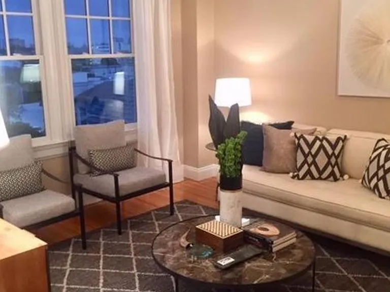 Potential furniture layout in living room. Tenant can paint the wall behind couch to their preference.