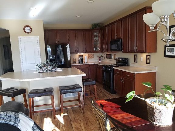 Kitchen is open to dining area, which has sliding glass door