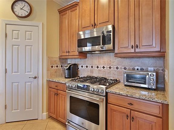 Fabulous kitchen with 10 ft. breakfast bar and salad sink.