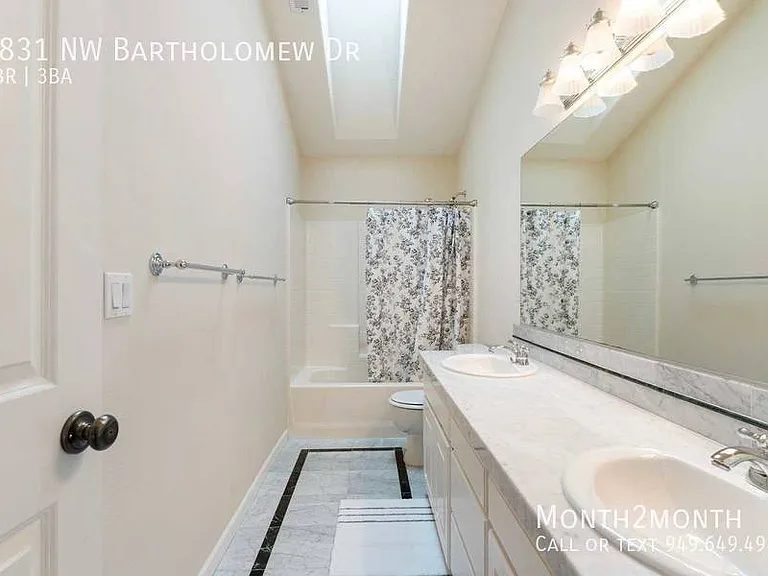 9831 NW Bartholomew Dr — Photo 22