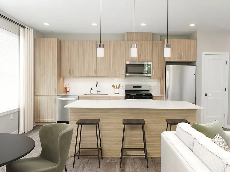 Base Collection kitchen with stainless steel appliances, quartz countertops, tile backsplash, oak cabinetry, and hard-surface flooring