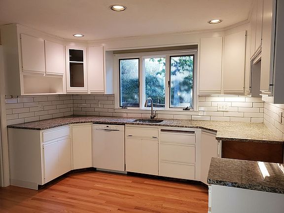 kitchen with new hardwood, granite