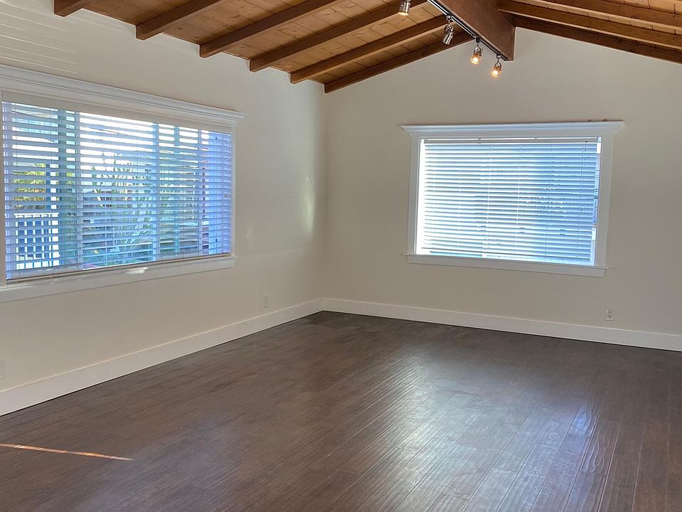 Open beam ceiling in living room adds character