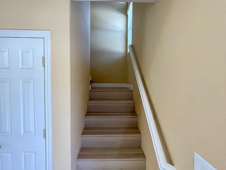 Stairway leading to the second floor. Also shown is the closet for storage on the first floor