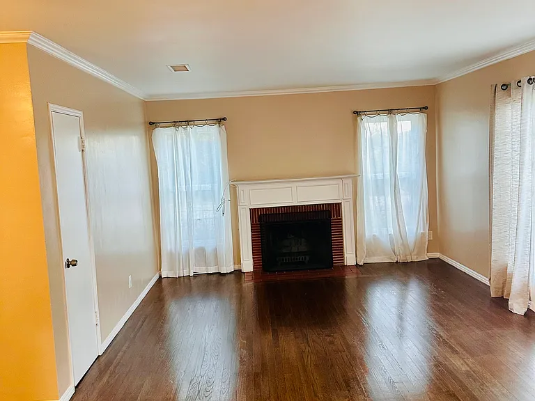 Formal living room with genuine wood flooring