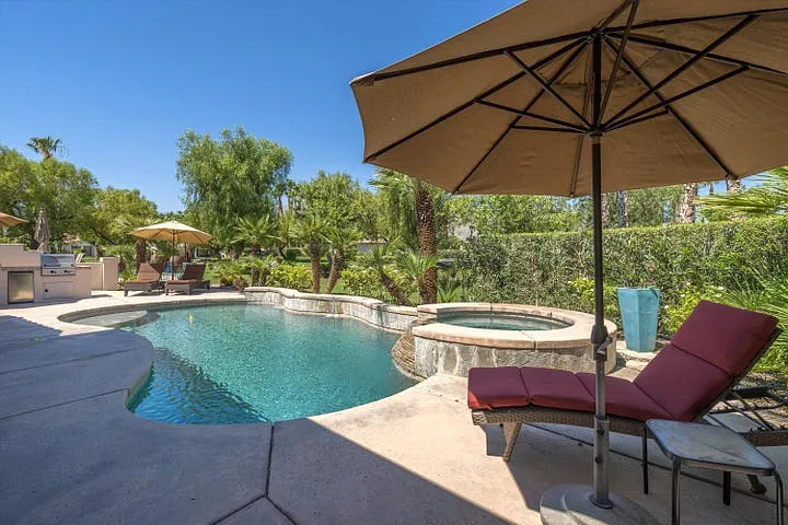 View of the pool/spa area from the lounge area of the back patio.