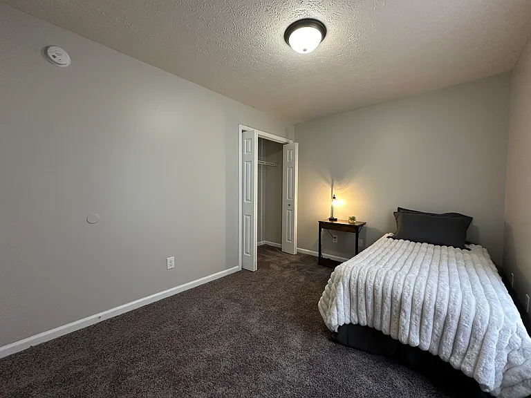 (3-Bedroom 1.5 Bath Unit) - Back Bedroom - Freshly painted and updated carpet.