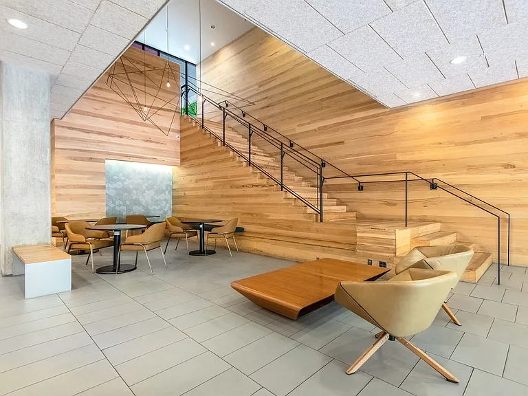 Contemporary Lobby Lounge with Statement Wood Staircase