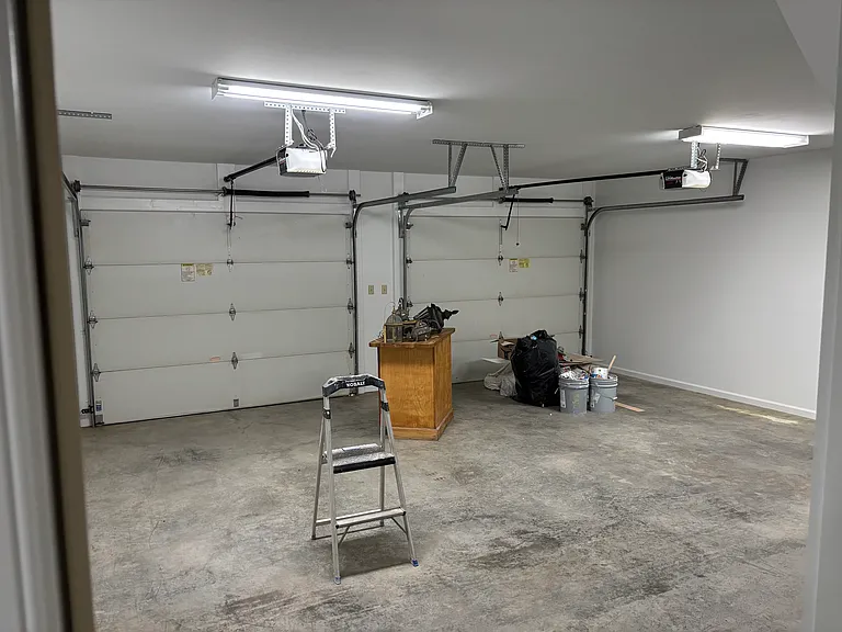 Large 2 car garage with stair walk up to floored attic