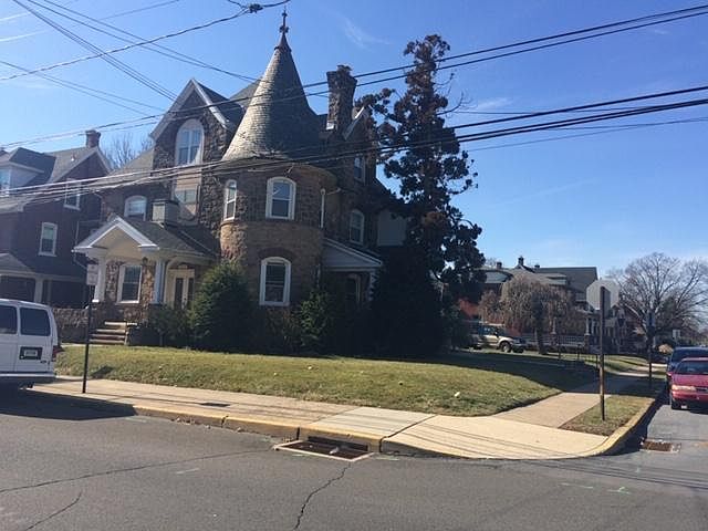 Unit is located in this historic building with a stone facade