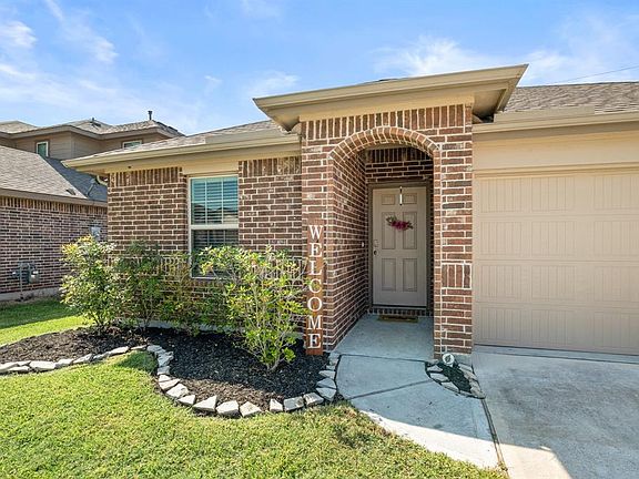 Before we head inside, let's take a moment to revel in this peaceful & welcoming view as we walk up to the front door. A darker trim framing the door allows it to stand out like a beacon welcoming you home!