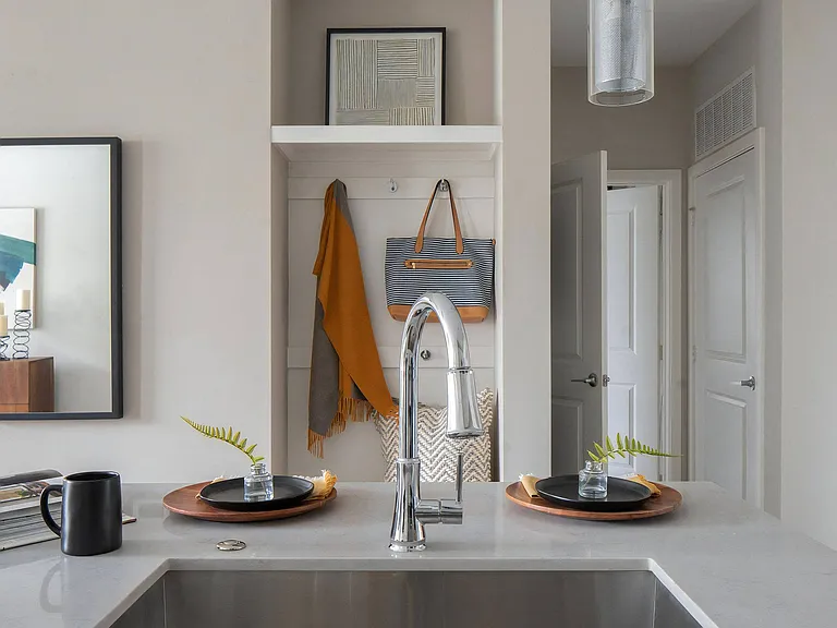 Functional Kitchen Layout with Island Seating and Entryway View