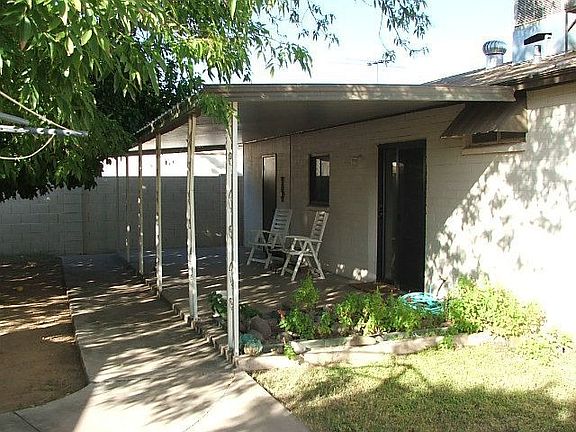 Large covered back patio to enjoy after a busy day.