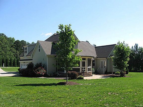 Screened porch overlooks private backyard!