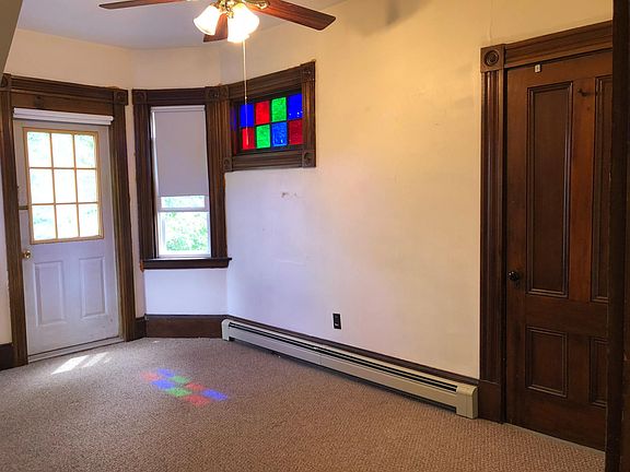Bedroom with ceiling fan and closet