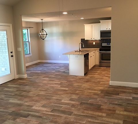 Wood-look tile flooring.