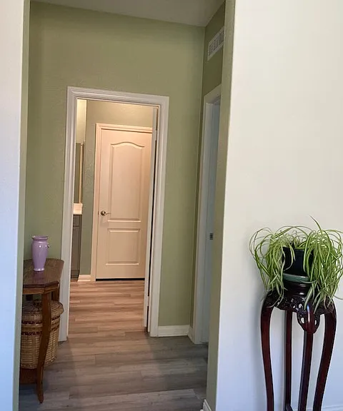 Foyer entrance to bedroom and bathroom. The foyer keeps the bed and bath separated from front entry.
