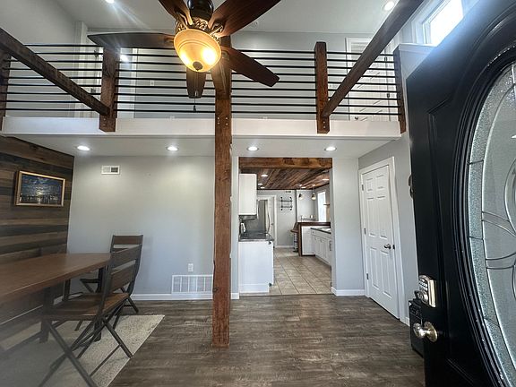 Entrance & dining area with coatt closet & storage