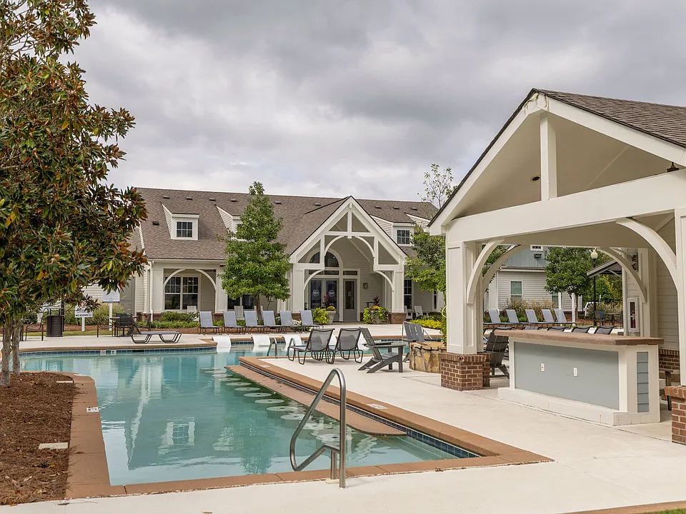 Enjoy resort-style living at The Flatts Starkville with poolside seating and luxurious outdoor amenities.