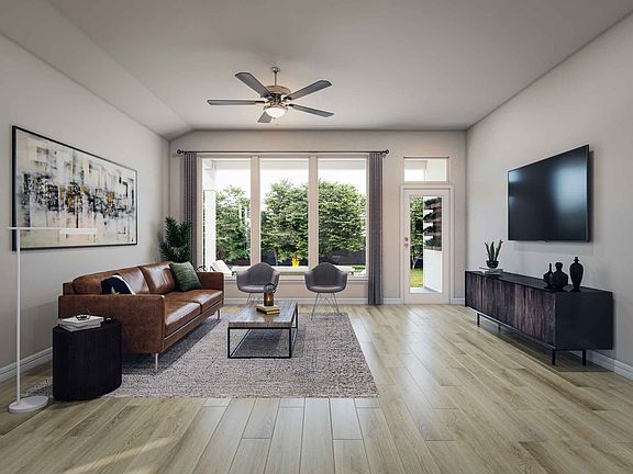 Open Great Room and Kitchen with Laminate Wood Flooring