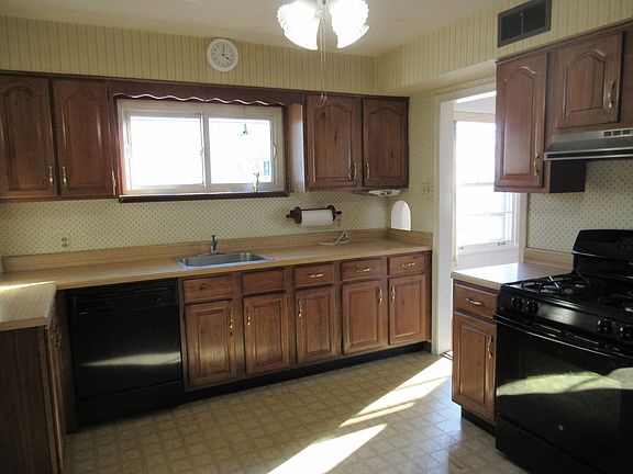 The kitchen is off the living/dining area and comes with appliances