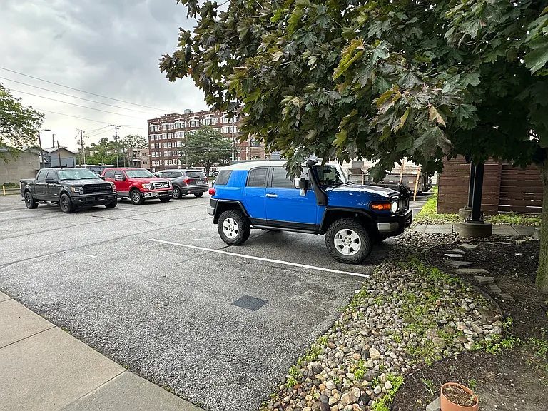 Designated parking space (blue car)