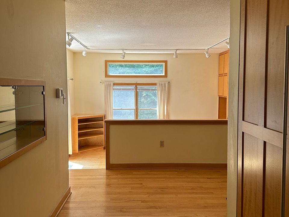 From the front entry past the dining room to the sunken living room