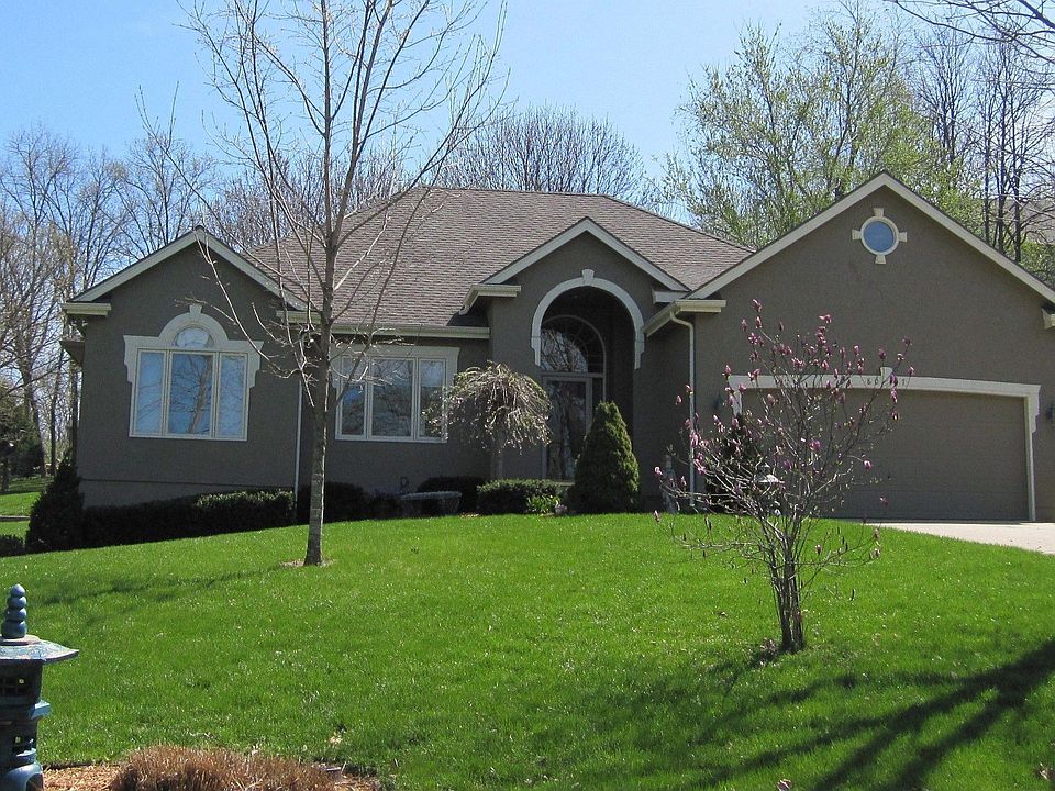 Fabulous Weatherby Lake views offered at 8007 NW Pleasant View Rd!