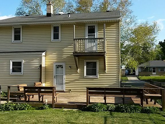 Rear of home w/ large deck