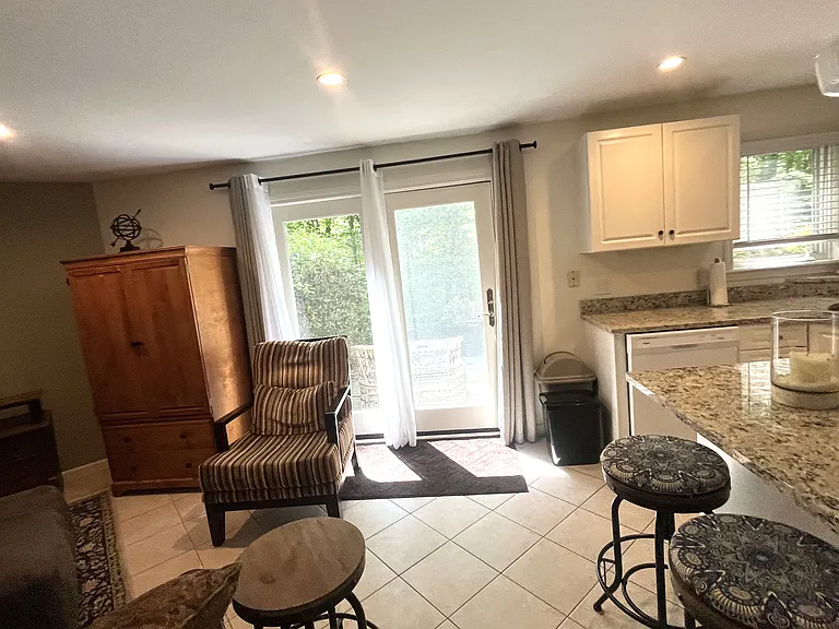 Living room and dinning room with view of the entrance to the patio