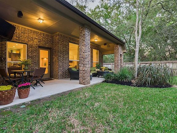 A long Attractive Patio extended across the back of the home showcased in Brock Columns. The Scenic Views from the Back of the Home are afforded from the Family, Kitchen, and Primary Bedroom.