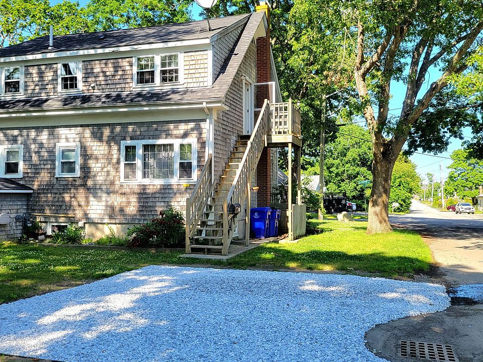 Parking area/steps to apartment