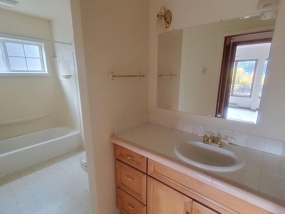 Main bathroom with full tub and shower, first floor.