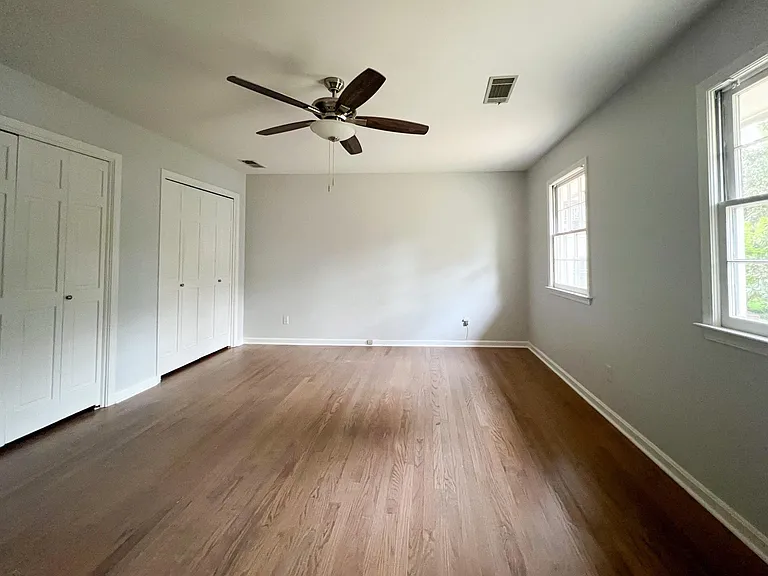 The primary bedroom has ample closet space and is larger than it appears here.