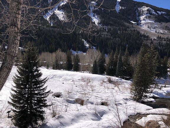 View of East Vail Chutes and Gore Creek from main level balcony.