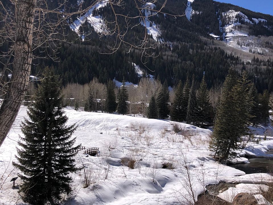 View of East Vail Chutes and Gore Creek from main level balcony.